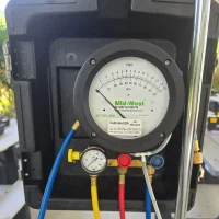 Testing-equipment-sq Differential pressure gauge and hoses connected to a Mid-West Instrument Model 835 used for certified backflow testing in Charlotte County.